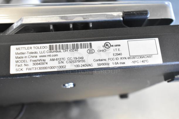 Mettler Toledo FreshWay AM-6127C produce scale, 100-240V, tested and working. Model info and FCC ID visible on label.