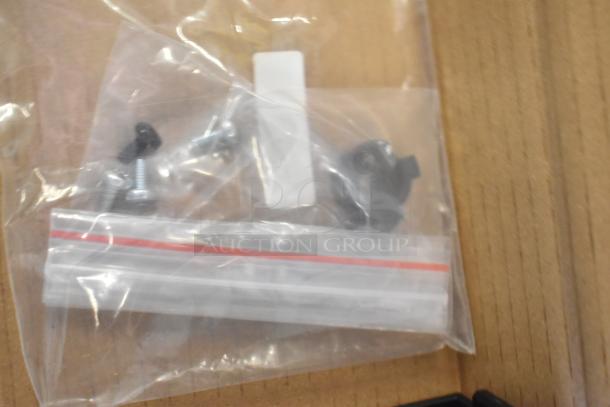 Bag of hardware components for Mettler Toledo FreshWay AM-6127C scale, including screws and knobs, in clear plastic packaging.