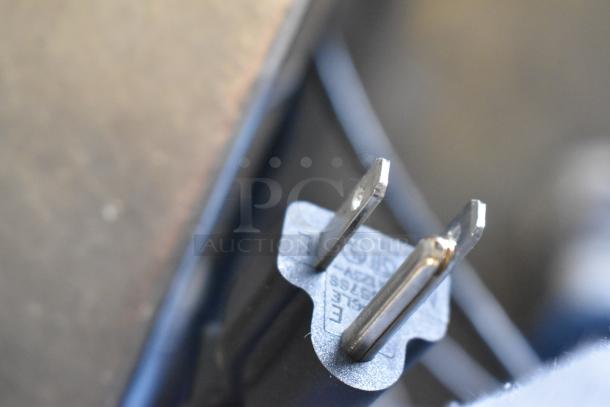 Close-up of a power plug for the Mettler Toledo FreshWay AM-6127C digital produce scale, 100-240V, 1 Phase.