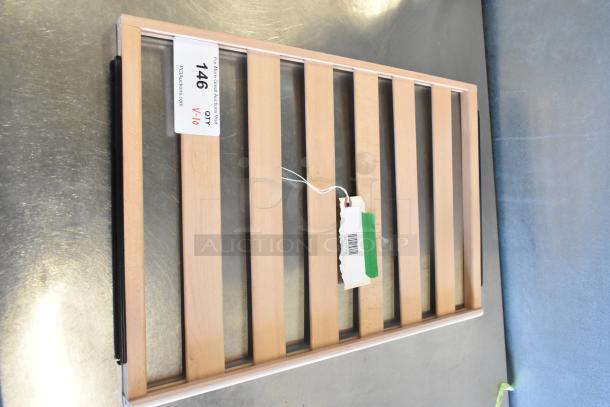 Alt Text: Wooden rack with slatted design, auction tag "146 QTY V-10" visible. New, scratch and dent condition.