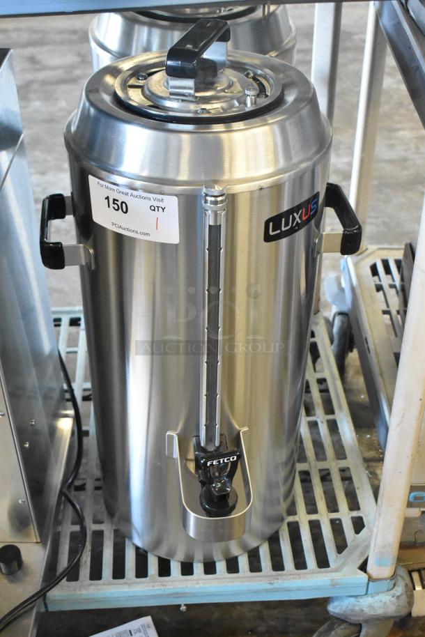 Brand new 2024 Fetco TPD-30 Luxus stainless steel 3-gallon coffee dispenser, scratch and dent condition, with visible labels.
