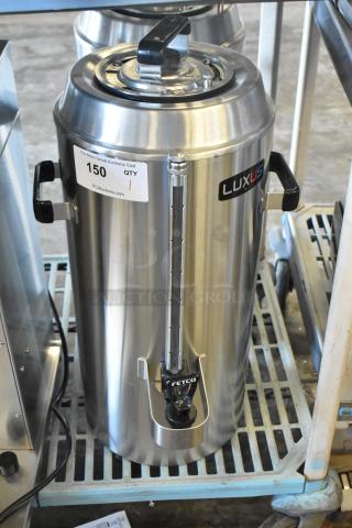 Brand new 2024 Fetco TPD-30 Luxus stainless steel 3-gallon coffee dispenser, scratch and dent condition, with visible labels.