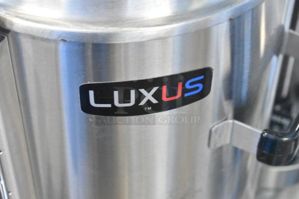 BRAND NEW 2024 Fetco TPD-30 Luxus 3 Gallon Coffee Dispenser, stainless steel, minor scratches visible on surface.