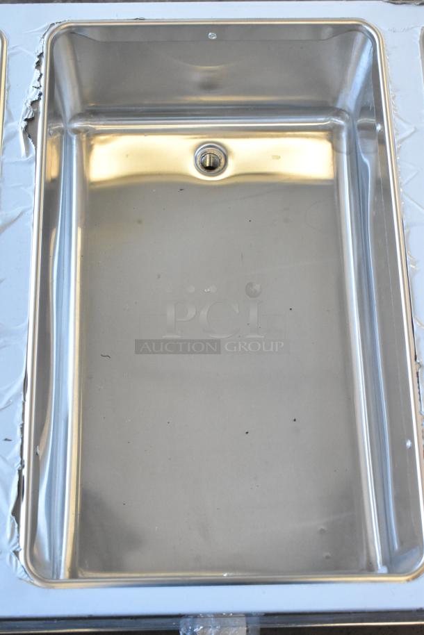 Brand new ServIt 423EST3WSPB electric steam table showing a scratched and dented sealed well. 120V, 1 Phase.