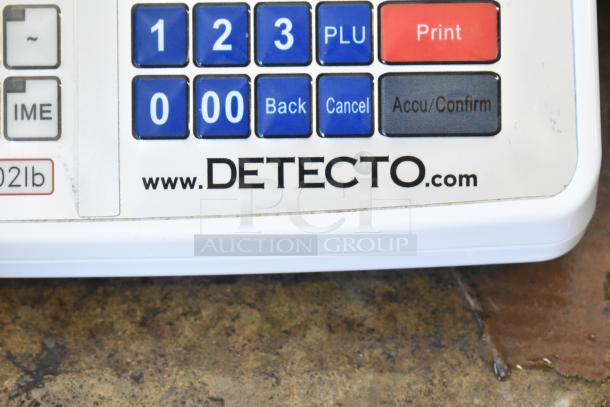 Cardinal Detecto DL1060P digital price computing scale, 60 lb. capacity, with printer and tower display, model plate showing.