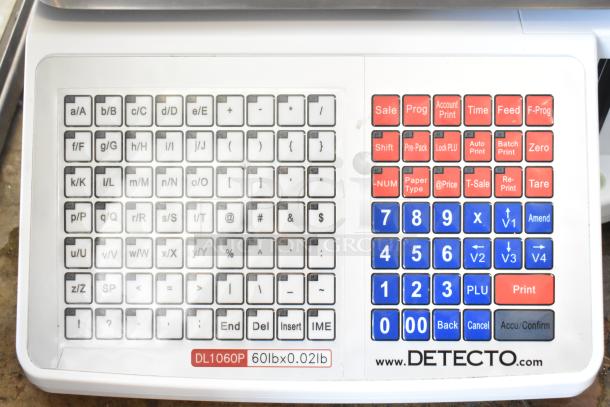 Detecto DL1060P 60 lb. digital price computing scale with printer and tower display, showcasing keypad and control buttons.