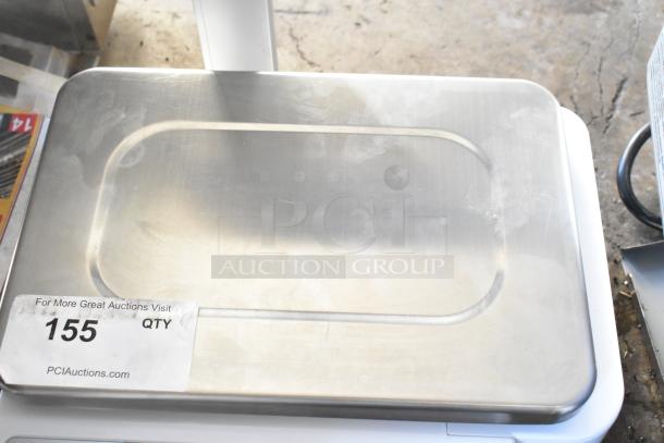 Detecto DL1060P 60 lb. digital price computing scale with printer and tower display, stainless platform, used condition.