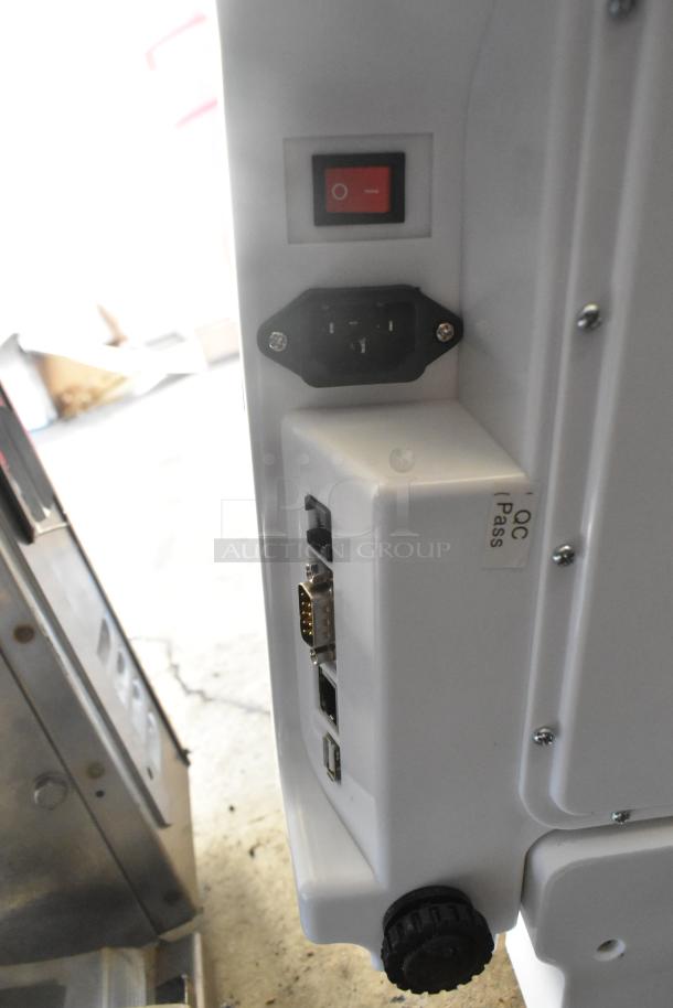 Cardinal Detecto DL1060P digital price computing scale, features include power switch, various connection ports, QC pass label visible.