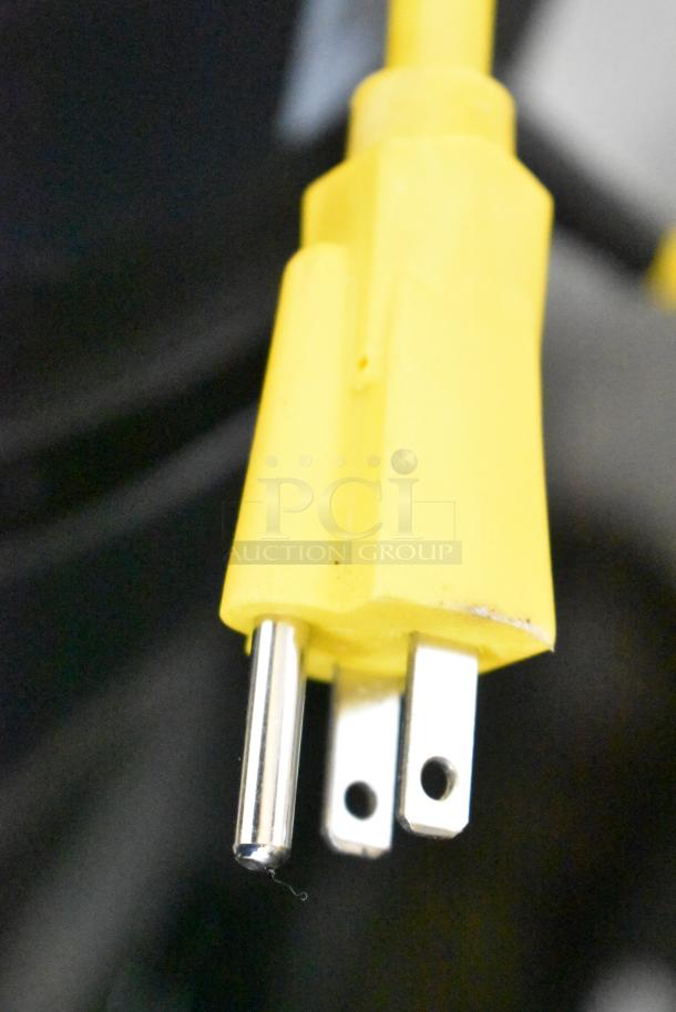 Viper SN18WD Shovelnose Wet/Dry Vacuum power plug, yellow, 120 Volts, 1 Phase. Close-up showing prongs.