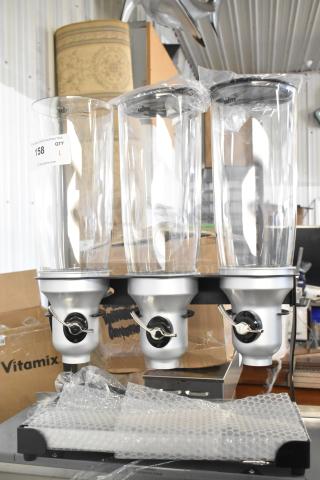 IDM Countertop 3 Well Dry Goods Dispenser in new condition. Features three clear containers and pull handles.