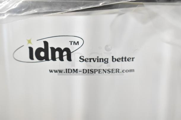 IDM Countertop 3 Well Dry Goods Dispenser with logo "Serving better" and website www.IDM-DISPENSER.com visible on label.