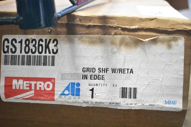 Metro GS1836K3 grid shelf with label; includes 4 green finish brackets, 2 Metro green wire shelves. Box condition worn.