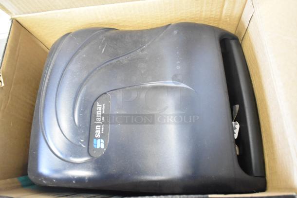 San Jamar T1390TBKB paper towel dispenser, black, gently used, logo visible, in original box.