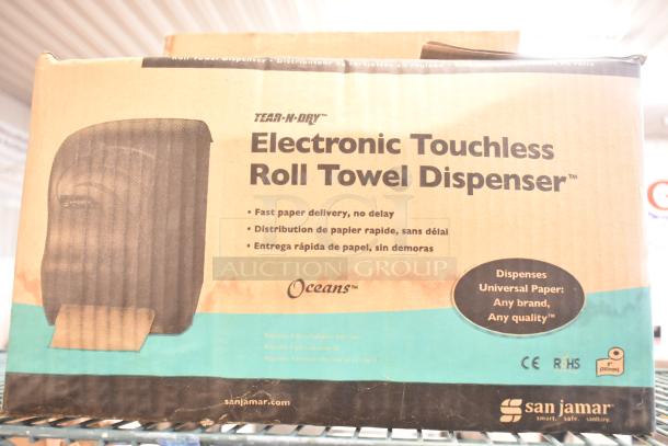 San Jamar T1390TBKB Touchless Paper Towel Dispenser in box. Fast paper delivery; universal paper compatibility.