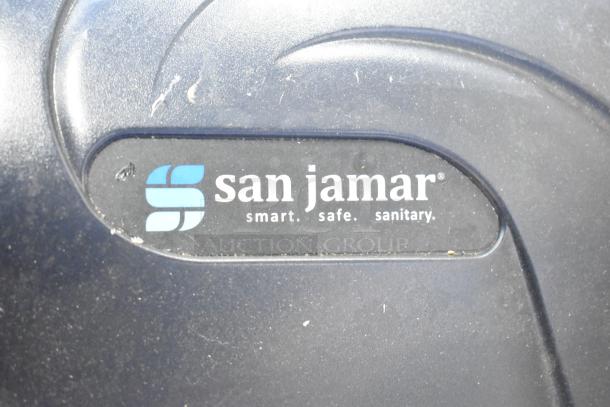 San Jamar T1390TBKB paper towel dispenser, black, logo visible, condition: some wear.