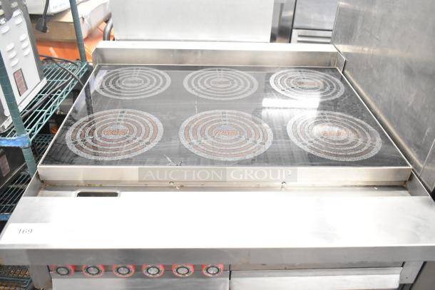 Lang RTI36E commercial electric 6-burner induction range. 208/240V, 3 phase. Stainless steel. Gently used condition.