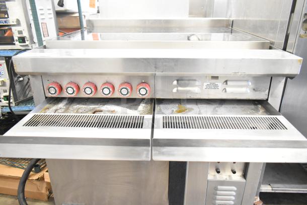 Lang RTI36E commercial induction range with 6 burners, electric powered, 208/240 volts, 3 phase, metal surface, used condition.