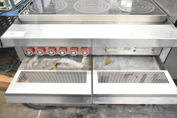 Lang RTI36E commercial electric 6-burner induction range, 208/240V, 3-phase. Wear visible; includes red control knobs.
