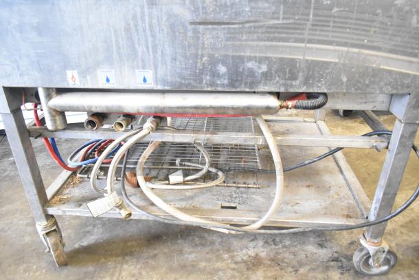 Blodgett 102/BCM2.10 commercial gas combi convection oven on casters, visible gas and water connections, fair condition.