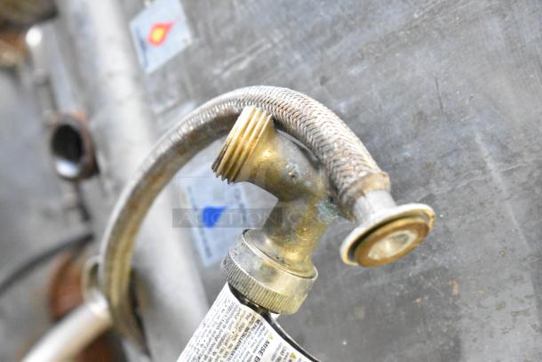 Close-up of a brass fitting and attached hose on a Blodgett 102/BCM2.10 commercial convection oven, showing wear.