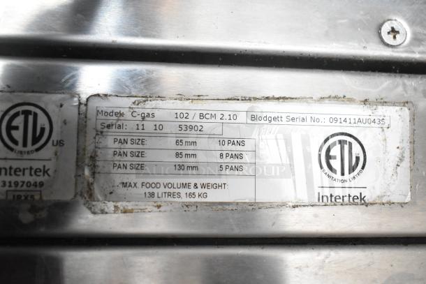 Blodgett 102/BCM2.10 commercial gas combi oven, model details on label, supports various pan sizes, ETL certified.