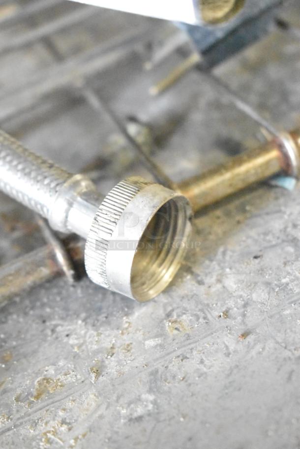 Close-up of Blodgett 102/BCM2.10 oven gas connector fitting on a textured surface.