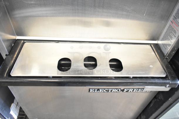 Electro Freeze 88T-RMT-137 soft serve ice cream machine, stainless steel exterior, visible brand logo, on casters.