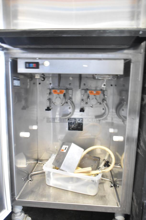 Electro Freeze 88T-RMT-137 ice cream machine interior. Water-cooled, dual-flavor with twist, commercial casters visible.