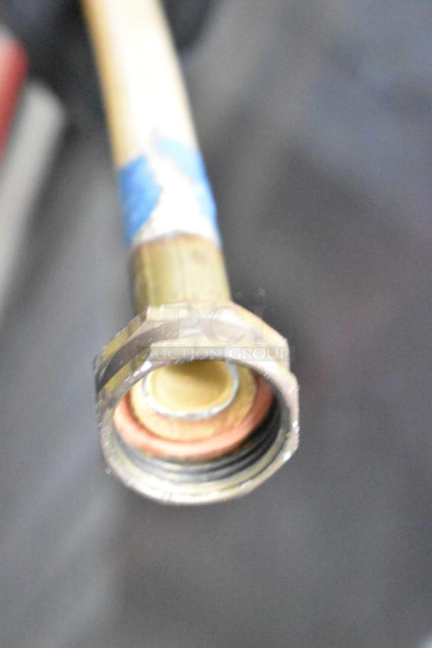 Close-up of a hose fitting for the Electro Freeze 88T-RMT-137 soft serve ice cream machine showing threading and seal.