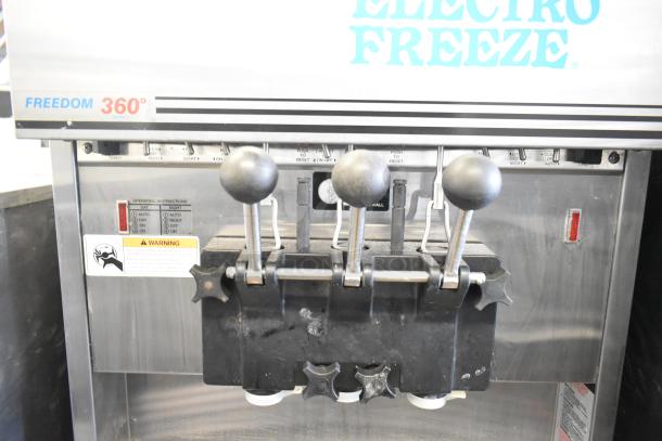 Electro Freeze 88T-RMT-137 soft serve machine, 2-flavor with twist, water-cooled, on commercial casters, controls visible.