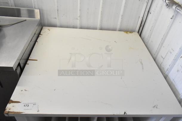 White counter with visible scratches and stains; slight wear on edges. Auction tag reads "173, QTY 1, PCAuctions.com."