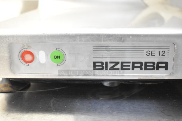 Bizerba SE 12 commercial countertop meat slicer, 120 volts, 1 phase, stainless steel, with on/off buttons.
