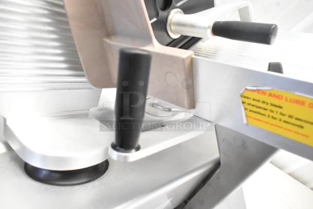 Bizerba commercial countertop meat slicer, 120V, 1 phase. Features adjustable knobs, smooth finish, includes usage instructions.