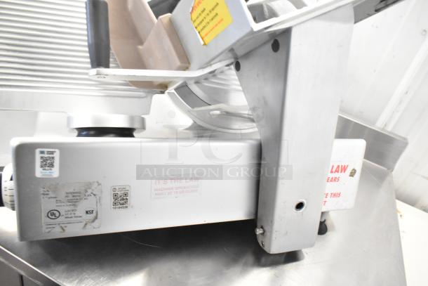 Bizerba Commercial Countertop Meat Slicer, 120V, 1 Phase, showing safety label and buttons, in good condition.