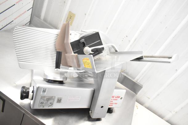 Bizerba commercial countertop meat slicer, 120 volts, 1 phase, shown in good condition with safety markings and controls.
