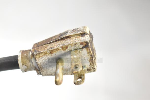 Close-up of a weathered electrical plug for a 2017 True TWT-48F-HC Commercial Freezer, 115 Volts, 1 Phase.