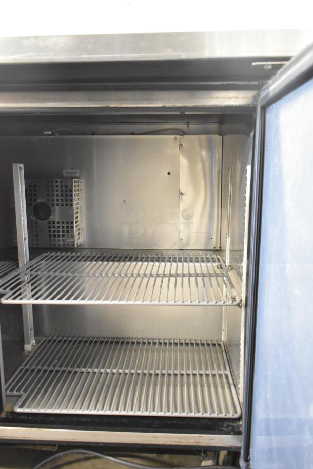 2017 True TWT-48F-HC 2 Door Work Top Freezer, commercial casters, 115V, 1 Phase, interior shelves, stainless steel, good condition.
