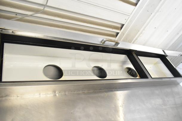 True TPP-67 Commercial Pizza Prep Table with stainless steel top, integrated compartments, and commercial casters. 115 Volts, 1 Phase.