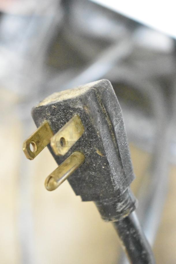 Power plug for True GDM-45-LD cooler, showing signs of wear. 115 volts, single-phase connection.