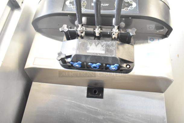 Taylor C712-33 soft serve machine, 2-flavor with twist, commercial water-cooled, on casters, 208-230V, 3-phase.