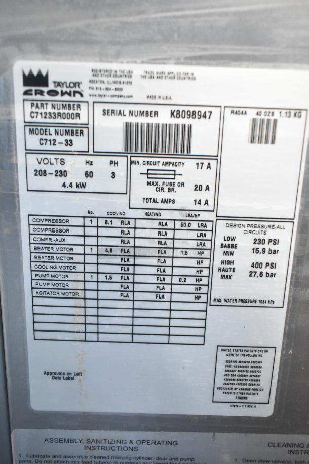 Taylor C712-33 commercial soft serve ice cream machine label showing model details and specifications including voltage and phase.