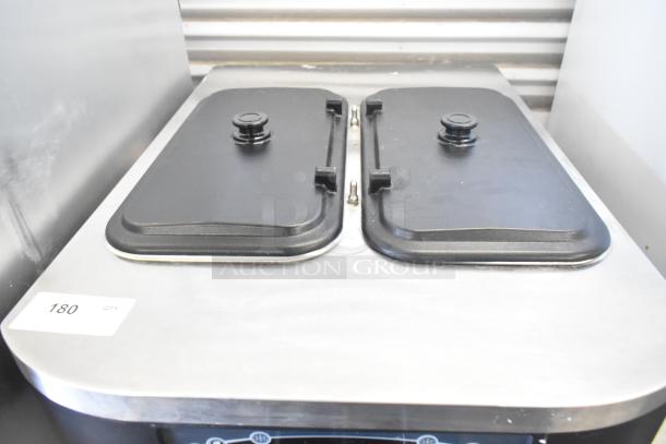 Taylor C712-33 soft serve ice cream machine, 2 flavors plus twist, water-cooled, commercial casters, 208-230V, 3-phase.