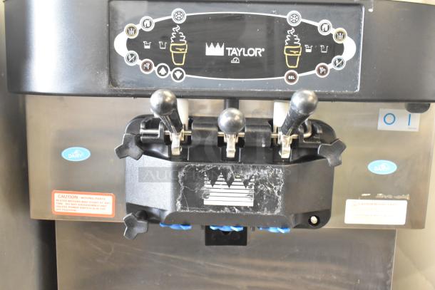 Taylor C712-33 soft serve ice cream machine, dual flavor with twist, commercial casters, water-cooled, 208-230V, 3-phase.