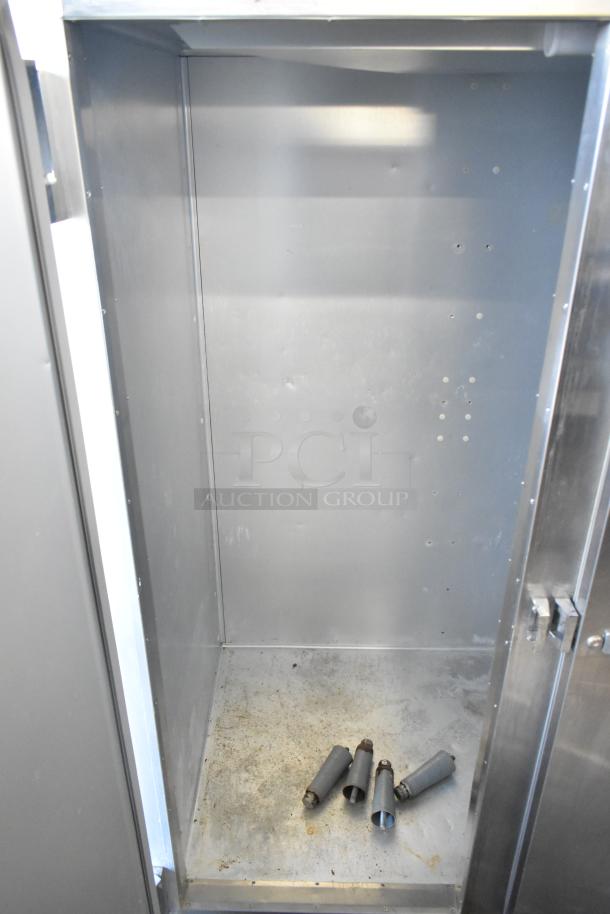 Traulsen G31010 3-door reach-in freezer, stainless steel interior, well-used condition, 115V, 1 phase power.
