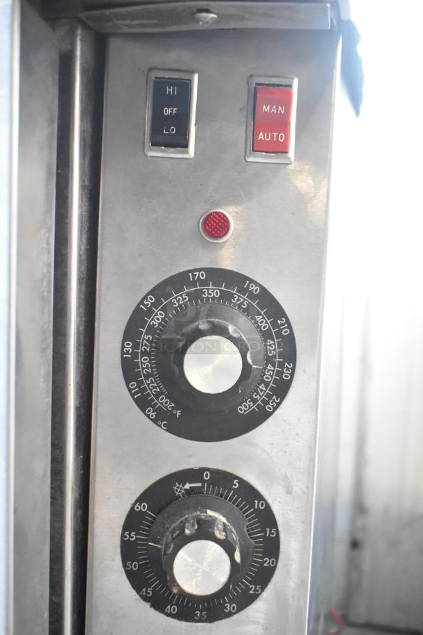 Blodgett commercial convection oven control panel with thermostatic controls, settings for temperature, manual, and auto modes.