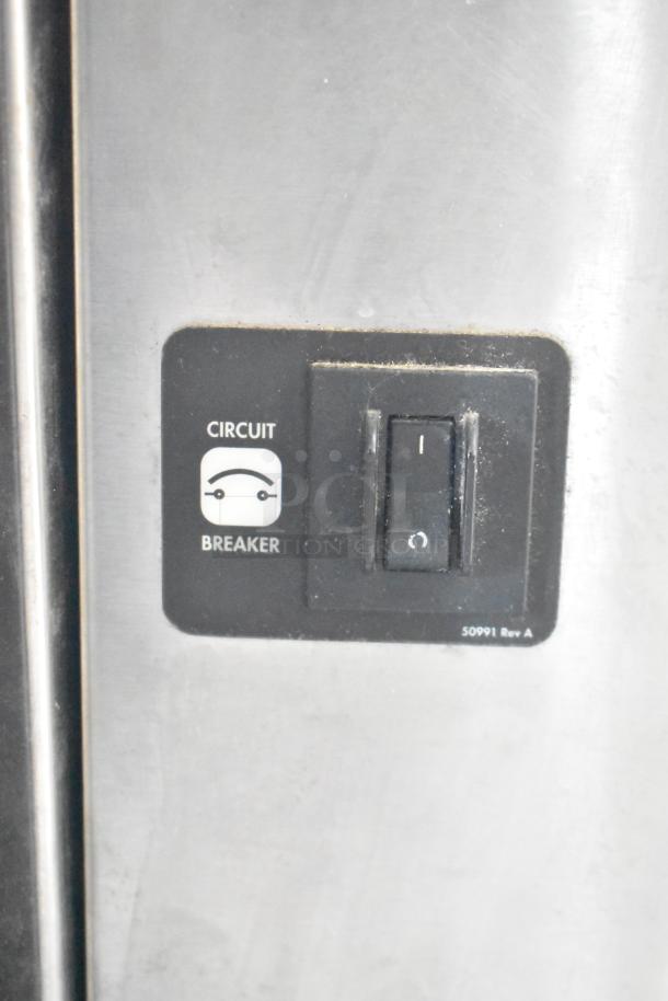 Blodgett commercial convection oven circuit breaker switch on solid steel door, model 50991 Rev A.