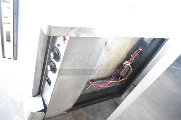 Blodgett commercial full-size convection oven with solid and view-through doors, thermostatic controls; side panel open showing wires.