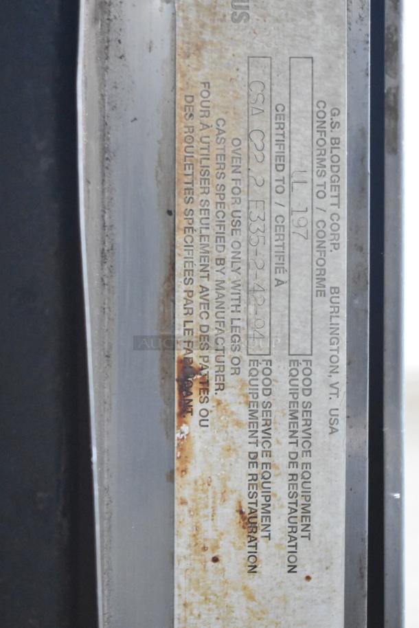 Blodgett commercial convection oven with solid and view-through door, thermostatic controls, visible certification label.