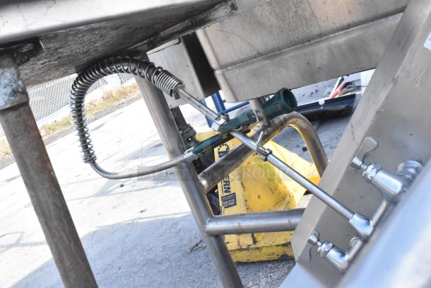 Commercial right side dirty dish table with sturdy stainless steel construction, pre-rinse sprayer, and dual faucets.