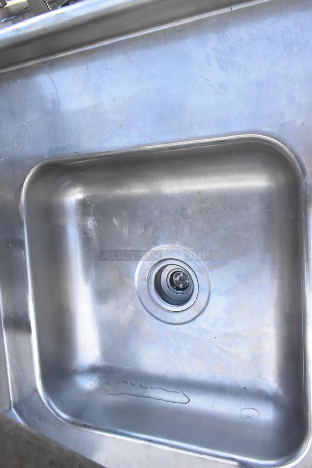 Commercial right side dirty dish table with stainless steel sink, visible scratches and wear, ideal for high-traffic kitchens.